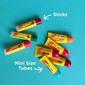 Carmex mini tube inside a purse showing compact travel convenience