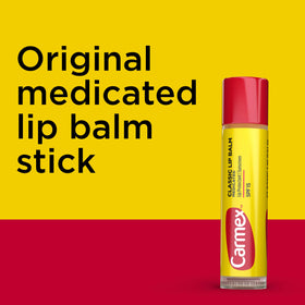 Carmex being applied outdoors to protect lips in sunny weather