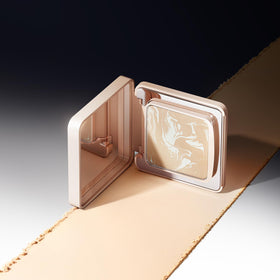 CARSLAN compact next to coin size comparison showing pocket-friendly travel convenience