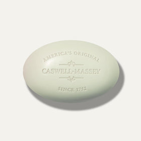 Caswell-Massey bars placed on ceramic soap dish in bathroom for lifestyle appeal
