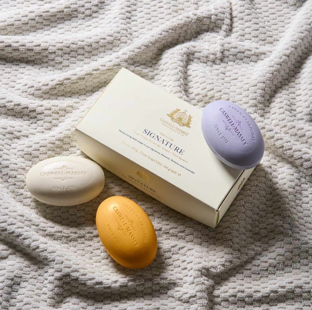Caswell-Massey lavender bar detail with flowers suggesting calming aroma and soothing wash