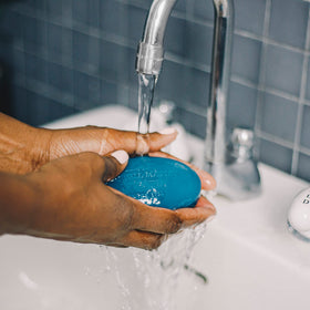 Caswell-Massey lather in hand demonstrating rich foam and moisturizing benefit