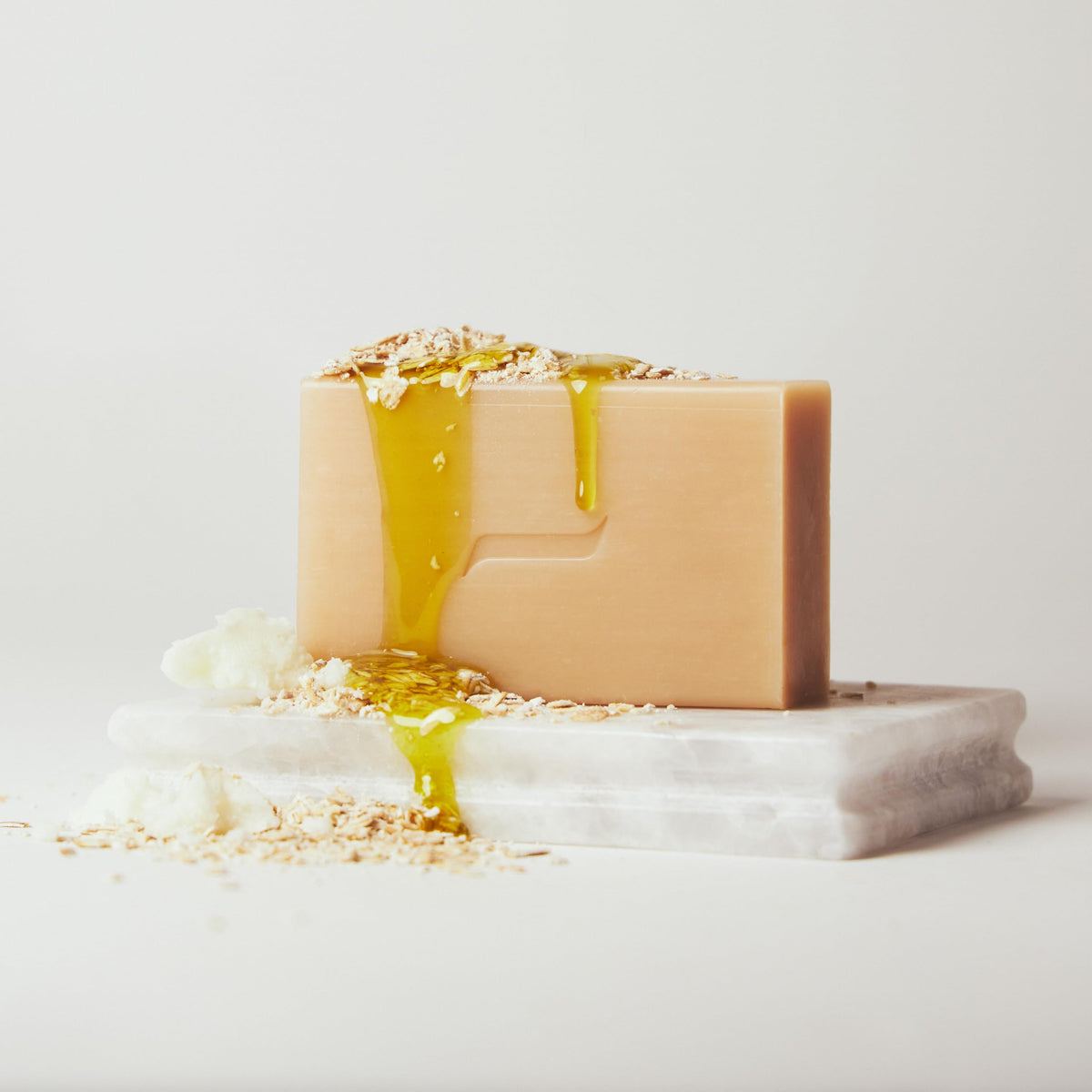 Caswell-Massey unboxed soap with shea and cocoa butter nearby