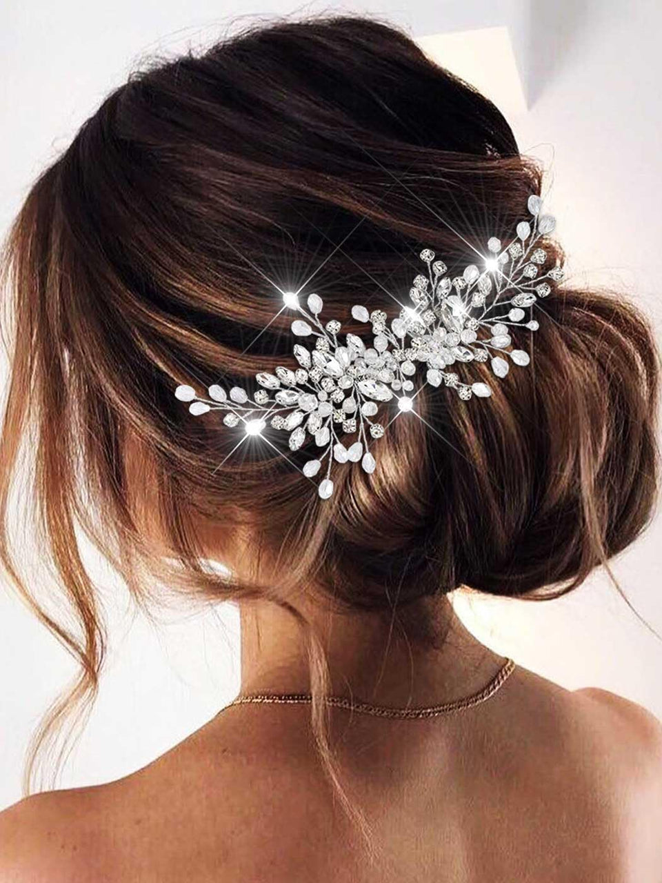 Catery front view of silver rhinestone comb showing sparkle and elegance
