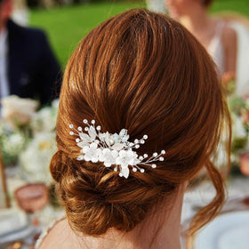 Catery comb placed in bridal updo showing secure placement and refined finish
