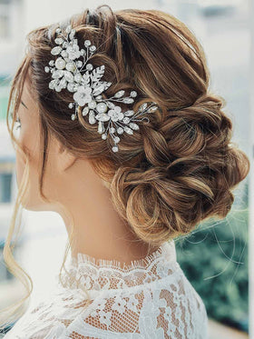Catery hair clip worn in a bride updo, completes wedding hairstyle