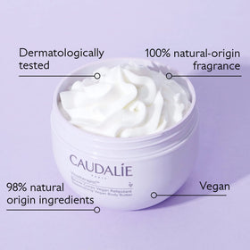 Applying Caudalie body butter to forearm, brand soothes and calms dry skin