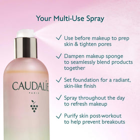 Caudalie on vanity with makeup showing dewy-setting spray benefit