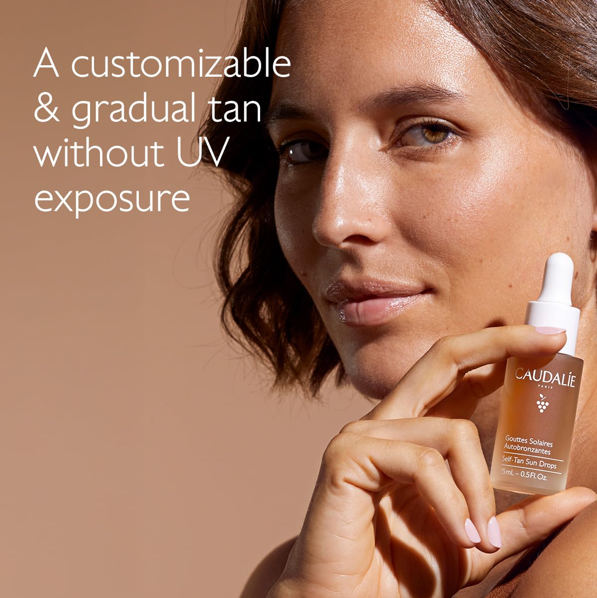 Caudalie dropper releasing liquid showing lightweight texture and easy mixing benefit