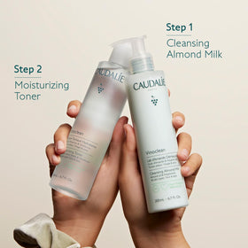 Caudalie 200 mL bottle next to everyday objects to show product scale
