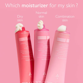 Hand applying VinoHydra cream from jar, demonstrating easy application and light feel