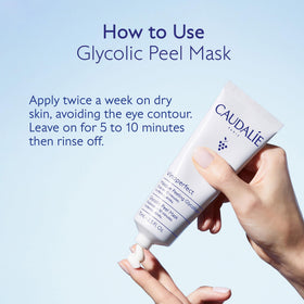 Tube of Caudalie Vinoperfect in hand showing scale and travel-friendly size