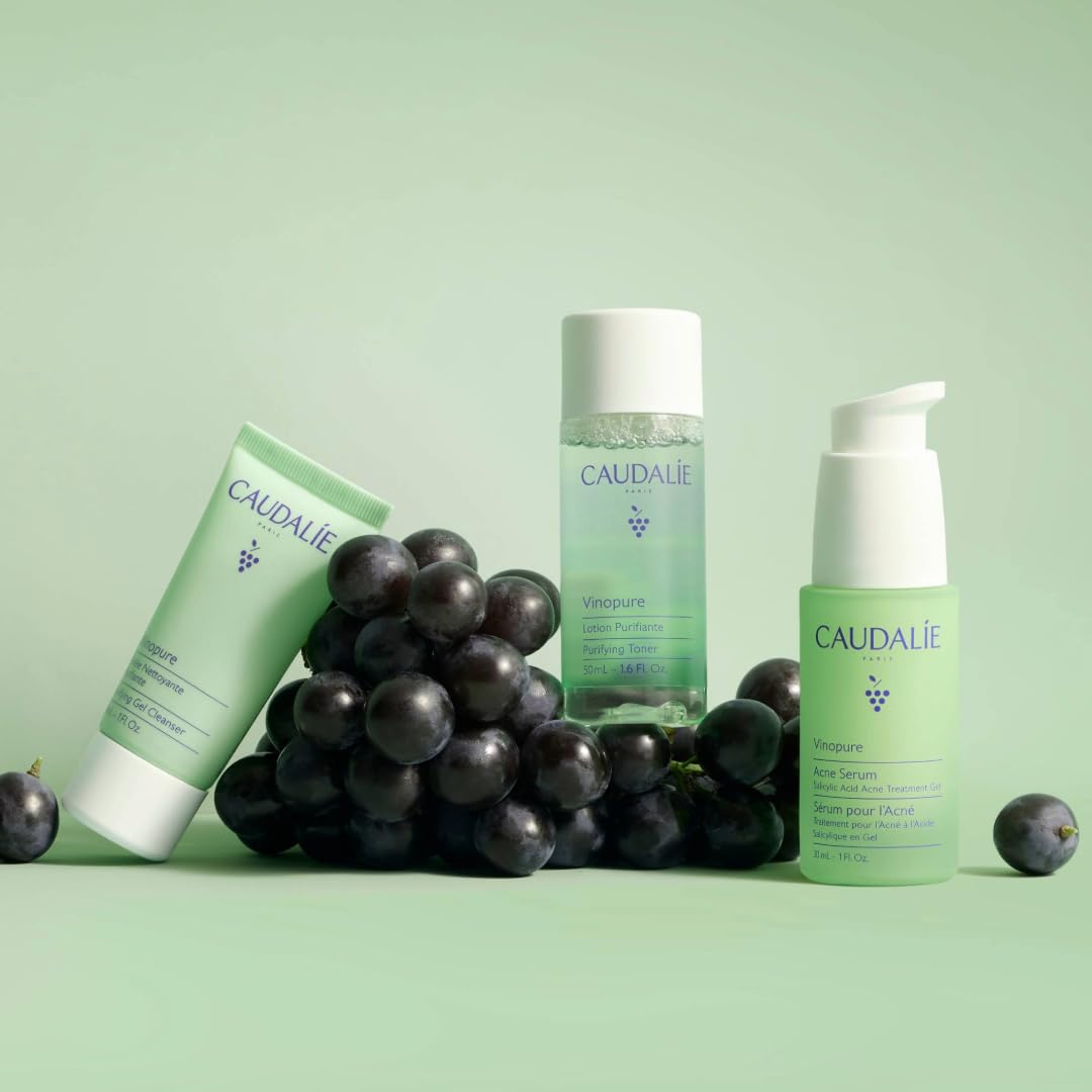 Caudalie Vinopure set held in hand for scale showing travel-friendly convenience