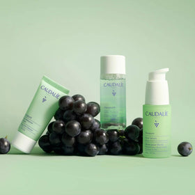 Caudalie Vinopure set held in hand for scale showing travel-friendly convenience