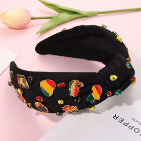 CEALXHENY headband next to a hand illustrating size and easy portability