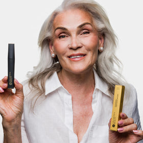Cellmetics application by woman at mirror demonstrating steady, precise use