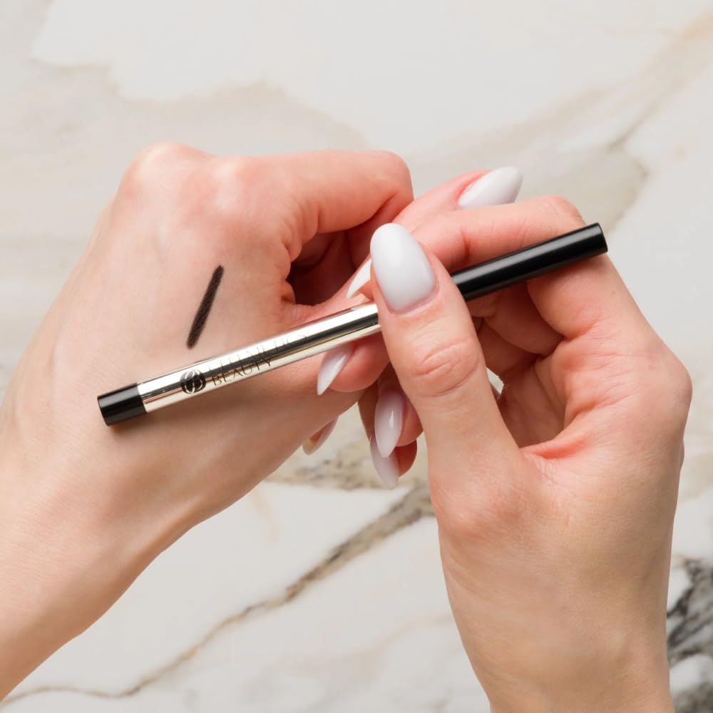 CELLMETICS mature woman applying eyeliner at mirror showing confidence-enhancing benefit