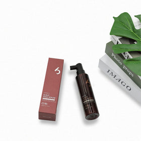 CH6 applying serum to scalp demonstrating targeted use for fuller-looking roots