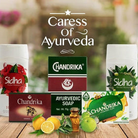 Chandrika sandal soap bar beside ruler showing size and clear ingredient label