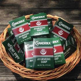 Chandrika bar in hand to show true 75 g size and easy travel-friendly convenience
