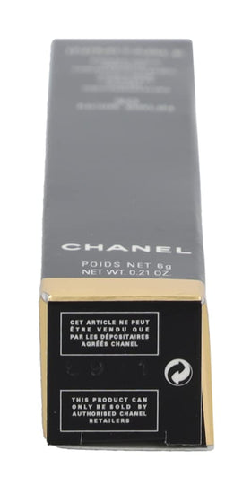 CHANEL mascara next to compact for scale and travel-ready convenience