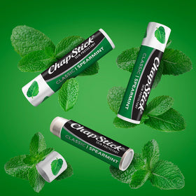 Twelve ChapStick tubes arranged on table demonstrating bulk value and variety