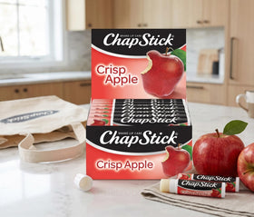 ChapStick close-up application on lips showing Crisp Apple moisturizing effect