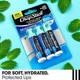 Close-up of ChapStick label listing aloe and vitamin E for conditioning benefit