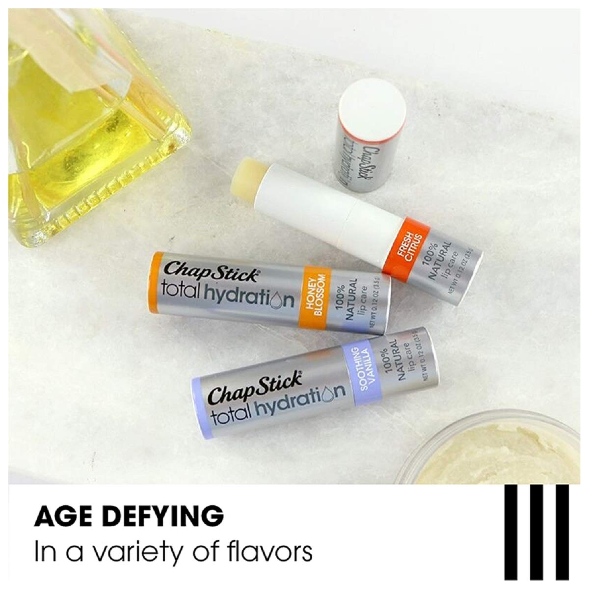 Hand holding ChapStick tube showing scale and everyday convenience