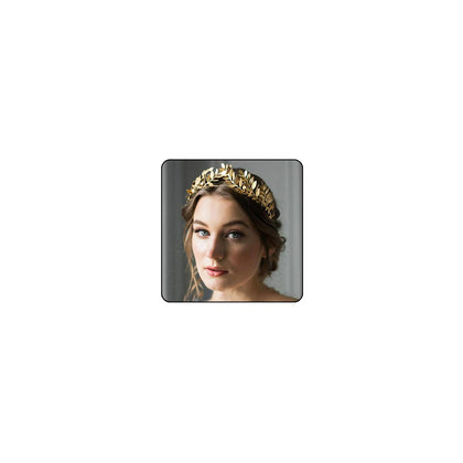 Chargances gold leaf crown front view showing regal finish and wearable design