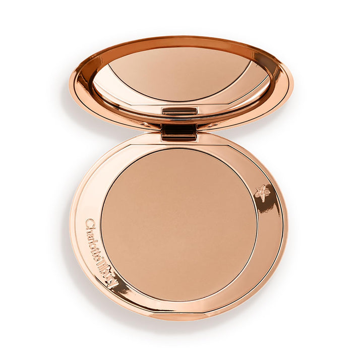 Charlotte Tilbury compact front view highlighting sleek design and travel convenience