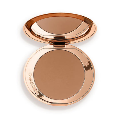 Charlotte Tilbury compact front view showing sleek refillable design and polished finish
