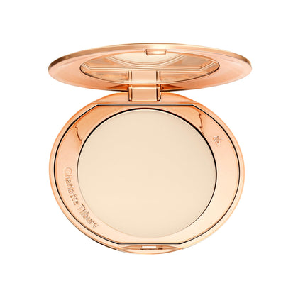 Charlotte Tilbury compact front showing sleek packaging and travel-ready design benefit