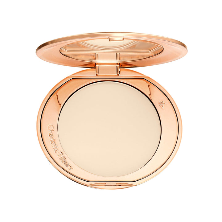 Charlotte Tilbury compact front showing sleek packaging and travel-ready design benefit