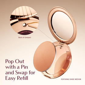 Charlotte Tilbury bronzer in a handbag flatlay showing travel-ready convenience