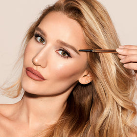 Charlotte Tilbury brow application showing natural filling and shaping