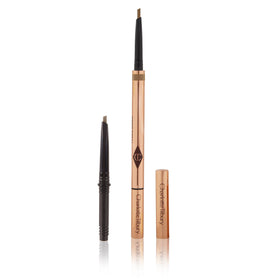Charlotte Tilbury pencil in use drawing fine strokes on brow for natural fill