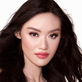 Charlotte Tilbury powder swatch showing smooth texture and light-reflecting micronized pearls