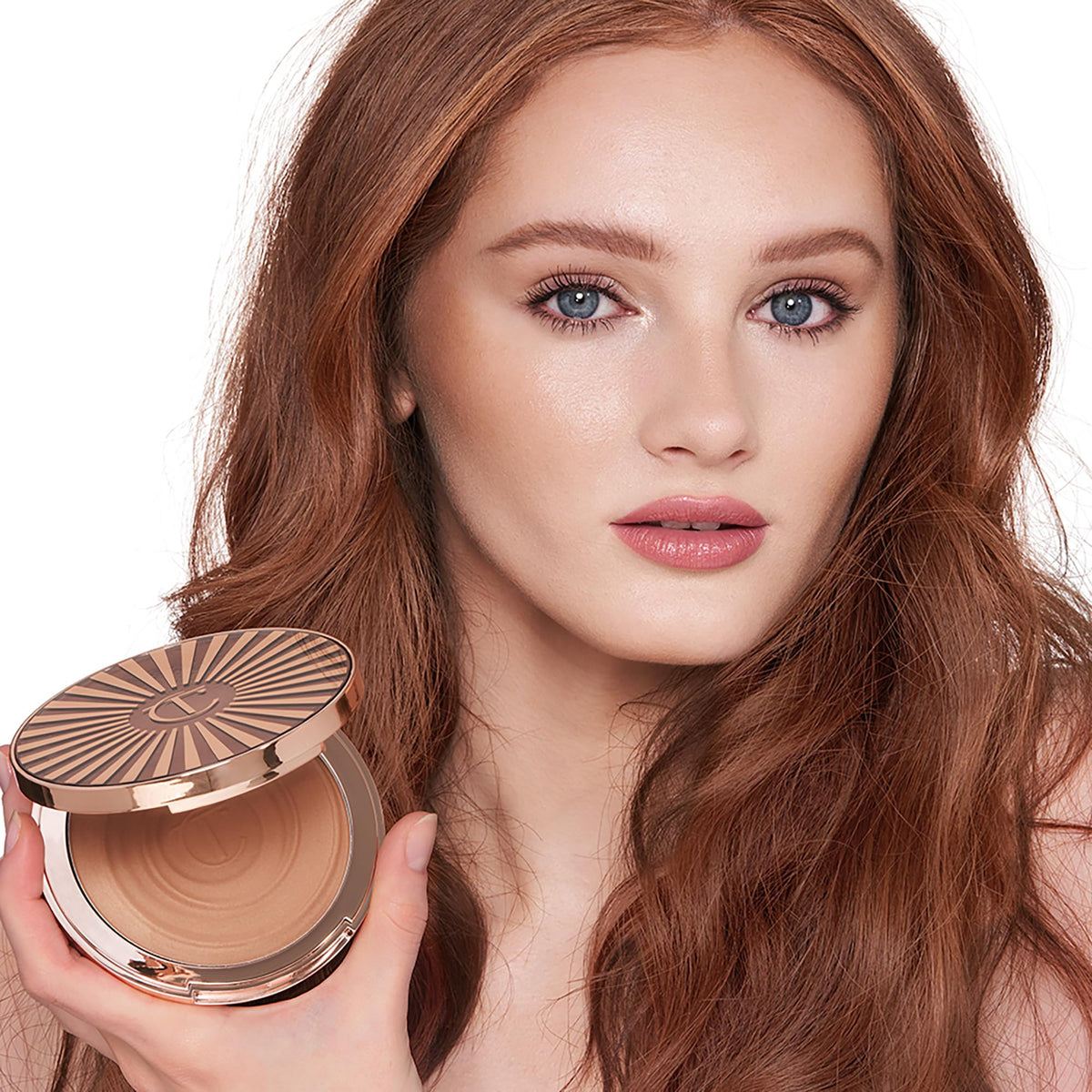 Charlotte Tilbury bronzer on face and body showing versatile head-to-toe glow