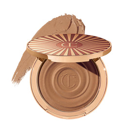 Charlotte Tilbury compact front view showing elegant packaging and shade