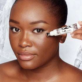 Product label and ingredient list of Charlotte Tilbury displaying peptides and caffeine benefits