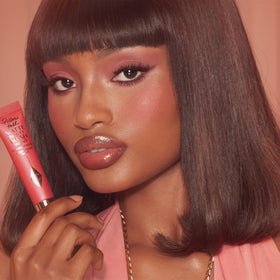 Charlotte Tilbury Dream Pop swatch on skin close-up showing blendable, buildable matte finish