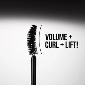 Charlotte Tilbury mascara on vanity with makeup items portraying everyday glamour use
