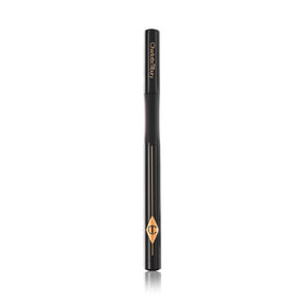 Charlotte Tilbury eyeliner applied creating a sharp cat-eye for confidence