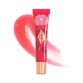 Charlotte Tilbury front packaging showing glossy tinted lip oil, conveys polished shine