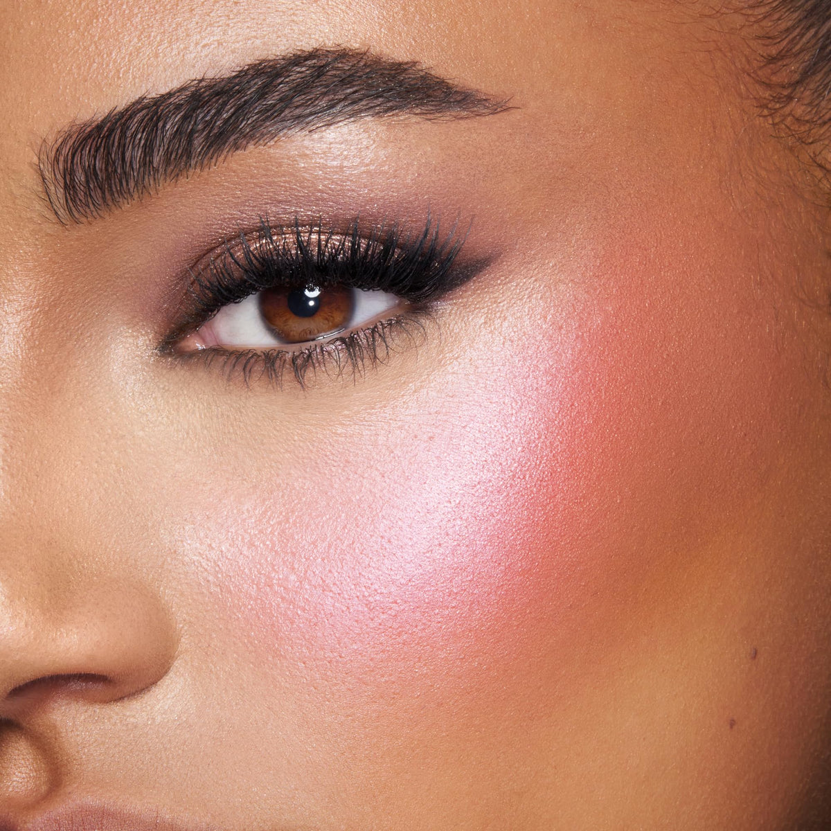 Charlotte Tilbury pearlescent highlighter pan detail for soft radiant sheen