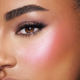 Charlotte Tilbury pearlescent highlighter pan detail for soft radiant sheen