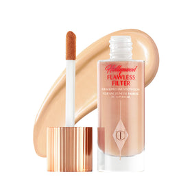 Charlotte Tilbury bottle front view showing elegant packaging and glow benefit