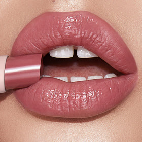 Charlotte Tilbury opened Happikiss showing soft fondue-like tip for smooth application