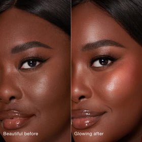 Charlotte Tilbury wand in hand to demonstrate size and portability